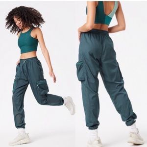 Outdoor Voices Windbreaker Pants in green size medium